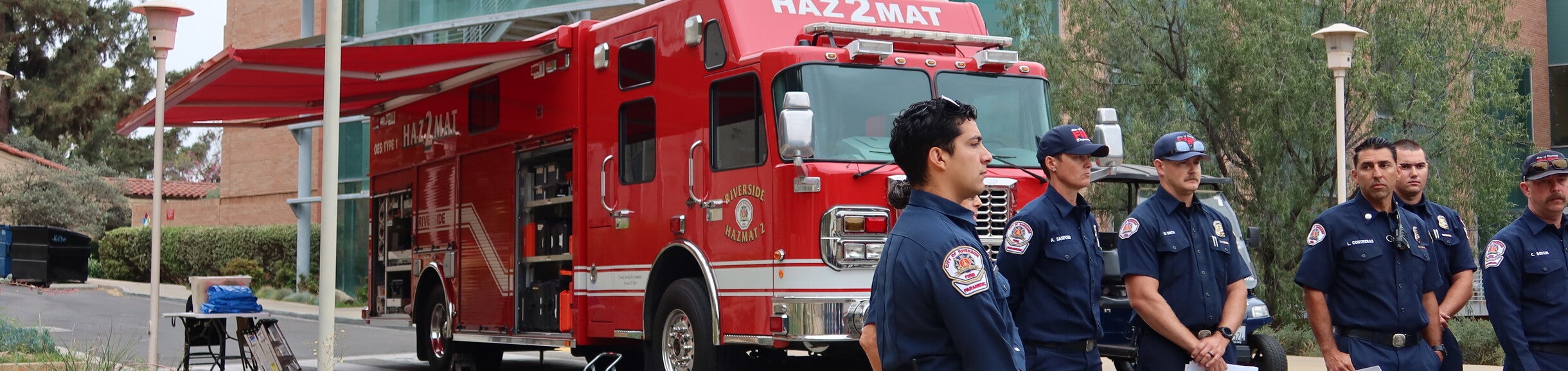 Firefighters standing in front of a Fire Truck