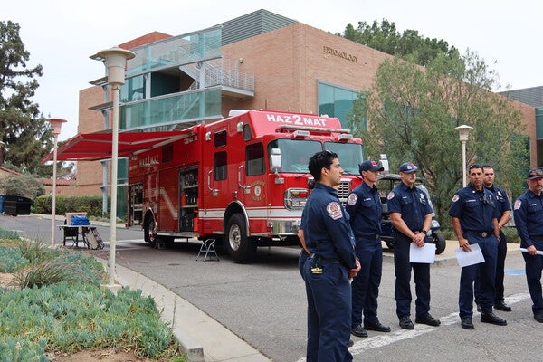 Firefighters standing in front of a Fire Truck